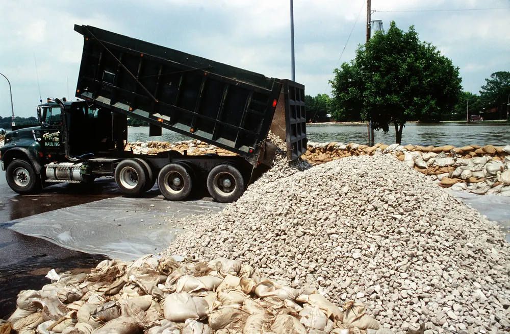 Dump truck placing rock near a levee on Leona Street along the Des Peres River in St. Louis in 1993